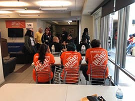 A group of people sitting in chairs at an event.